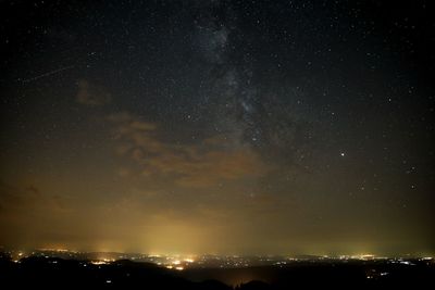 Low angle view of illuminated sky at night