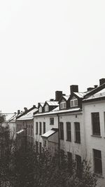 Houses against clear sky in city