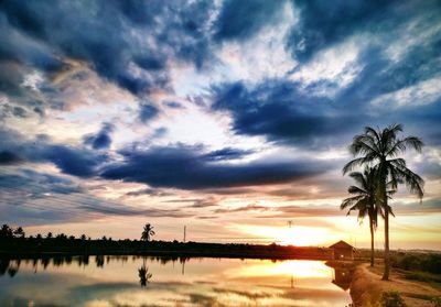 Scenic view of lake against sky during sunset