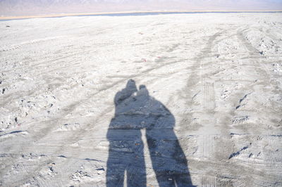 High angle view of person shadow on land