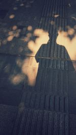 Low section of people standing on footpath