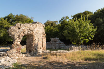 Old ruin on field against clear sky