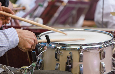 Cropped hands playing drum
