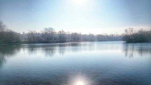 Scenic view of lake at sunset