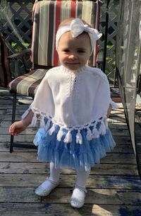 Full length of cute girl with arms outstretched