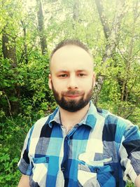 Portrait of young man in forest