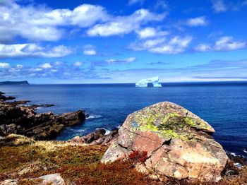 Scenic view of sea against cloudy sky