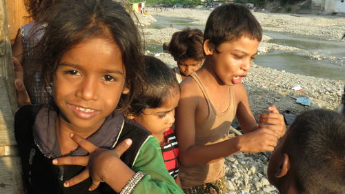 Portrait of mother and daughter in water at park