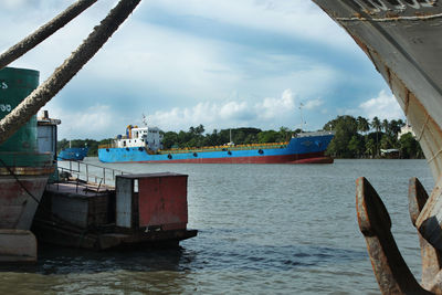 View of boats in sea against sky
