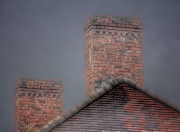 Low angle view of brick wall