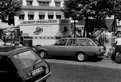 Cars parked on street in city