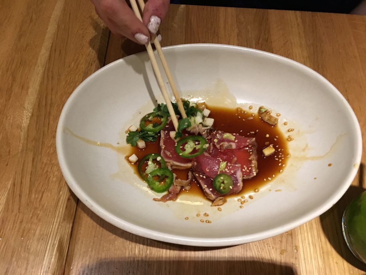 Hand eating from bowl