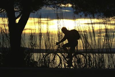 Silhouette of people at sunset
