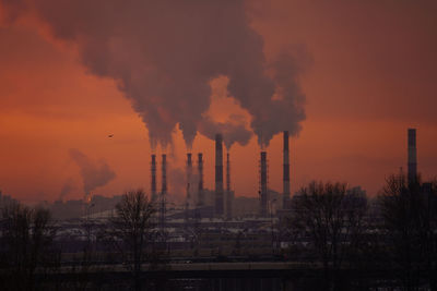 Smoking pipes of factory, heating station or power plant. environment pollution from carbon in city