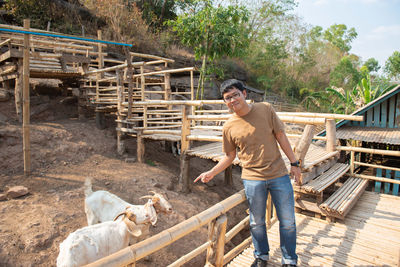 Full length of man standing in farm