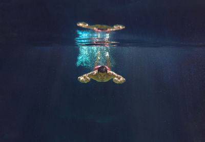 Woman swimming in sea