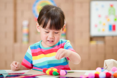 Young girl making craft for homeschooling