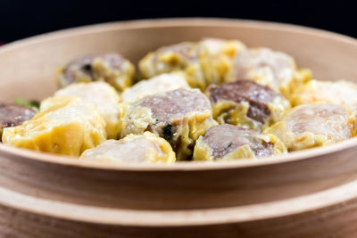 Close-up of chinese dumplings in bamboo basket