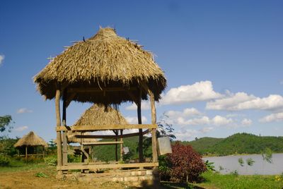 Low angle view of traditional windmill against clear sky