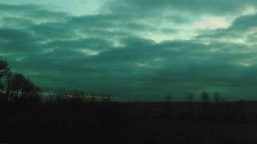 Scenic view of landscape against cloudy sky