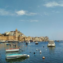 Boats moored at harbor