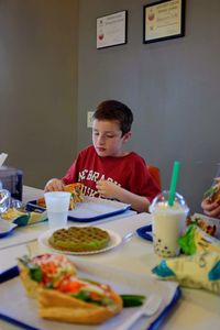 High angle view of man having food on table