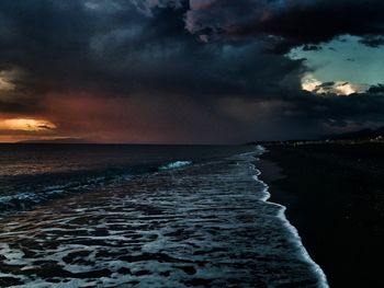 Scenic view of sea against dramatic sky