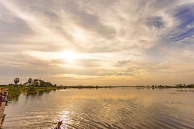 Scenic view of lake against sky during sunset