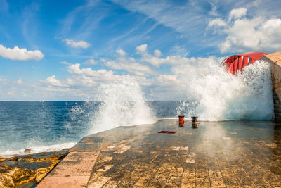 Waves and breakwater at the st. elmo bridge