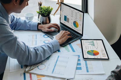 Businessman planning strategy on laptop in office