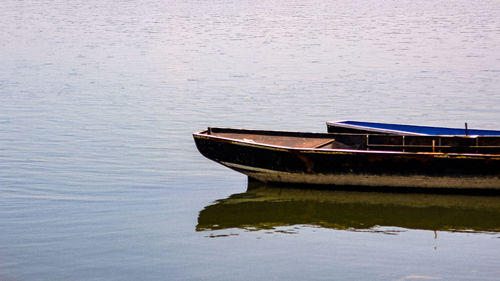 Boat moored in lake