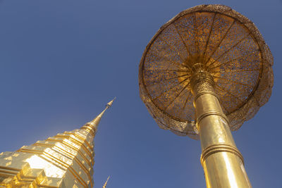 Low angle view of traditional building against clear blue sky