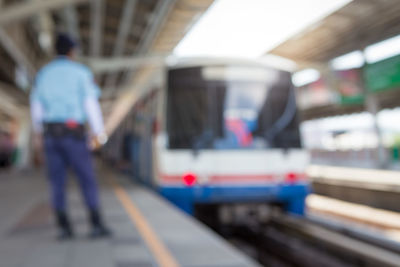 Blurred motion of train at railroad station