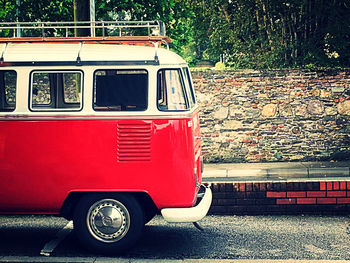 Red vintage car on street