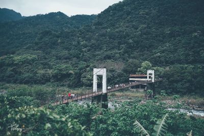 Built structure in forest against mountain