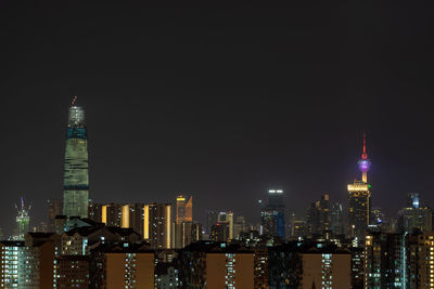 Illuminated buildings in city at night