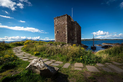 Castle against cloudy sky