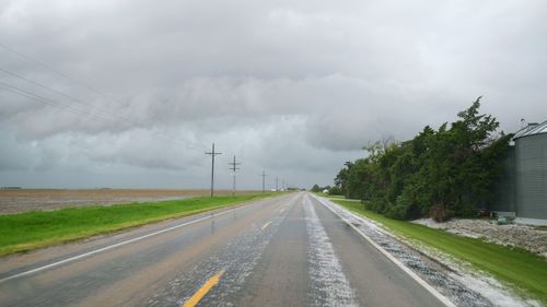 View of road against cloudy sky