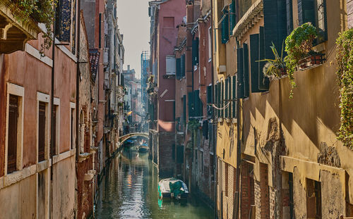 Canal amidst buildings in city