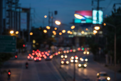 Defocused image of illuminated city at night