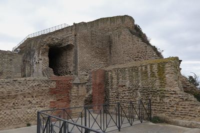 Old ruin building against cloudy sky