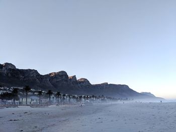 Scenic view of beach against clear sky