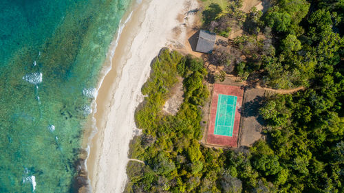 Aerial view of the tennis court next to the ocean in dar es salaam