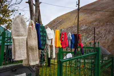 Low angle view of clothes drying on railing against wall