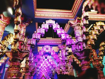 Low angle view of illuminated lanterns against sky