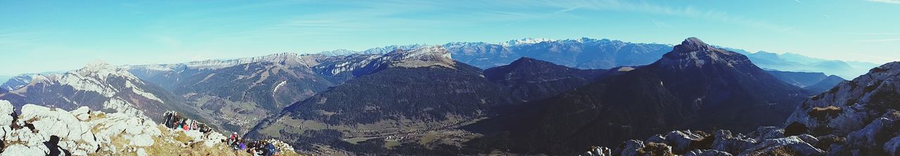 mountain, mountain range, beauty in nature, tranquil scene, tranquility, scenics, nature, sky, landscape, snow, blue, snowcapped mountain, winter, idyllic, non-urban scene, cold temperature, day, growth, sunlight, plant