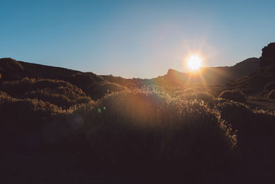 Scenic view of mountains against sky during sunset