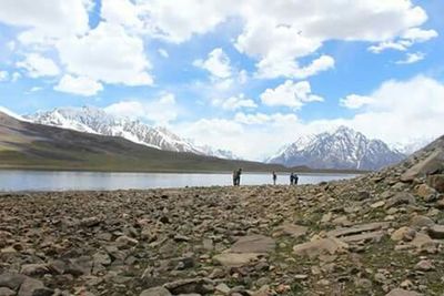 Scenic view of lake against cloudy sky