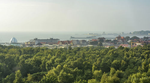 High angle view of trees and buildings against sky