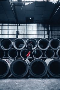 Person walking on concrete pipes